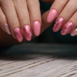 Classic Manicure: This foundational service includes nail trimming and shaping, cuticle care, a soothing hand massage, and the application of regular polish.
